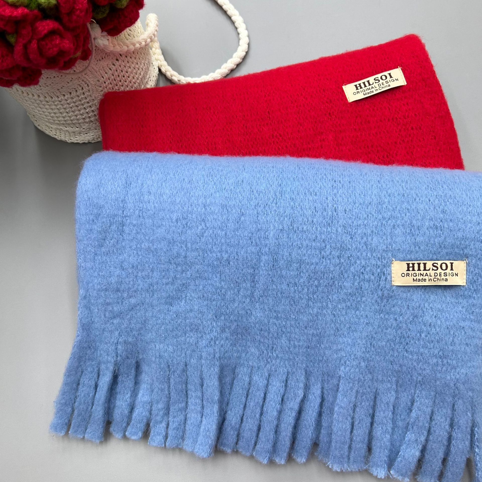 The 2024 new solid-color scarf is a must-have for women, providing warmth in winter. It's a Japanese-style, fashionable and versatile design. The thickened tassel faux cashmere scarf is also available