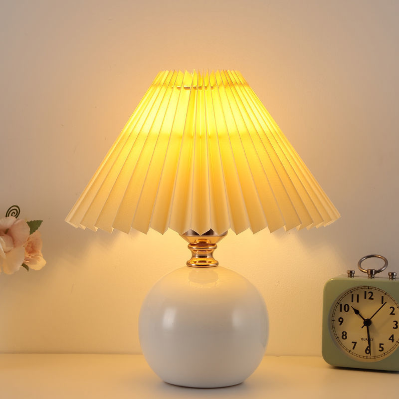 Nordic InS-style bedroom bedside lamp, Internet celebrity, warm and cozy night light for a young girl breastfeeding, high-end ceramic pleated table lamp Application Scenario