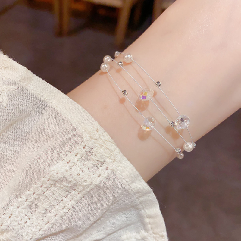 Amazon cross border fashion simple cristal perla de tres capas de línea de pesca pulsera temperamento ligero lujo diseño versátil sentido de la mano decoración Specification image