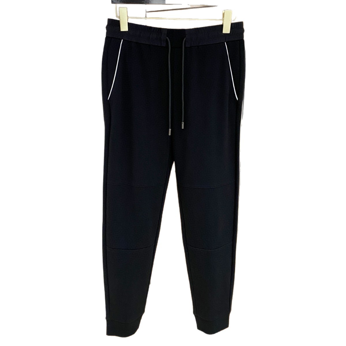 The European station's autumn collection features a new trend of simple and fashionable embroidered color-blocking, tight-waisted, drawstring, and tight-fitting men's business casual pants Item Picture