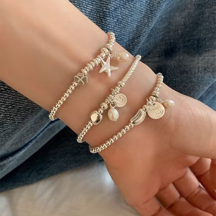 S925 sterling silver simple and elegant starfish smiling face pendant beaded bracelet, light luxury, niche and exquisite, a perfect accessory for your best friend