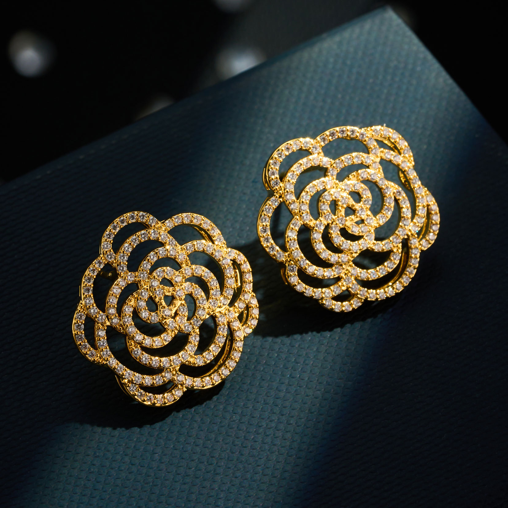French retro hollowed-out camellia ear studs, copper alloy, real gold electroplated, slightly inlaid zircon S925 silver needle exquisite earrings Application Scenario