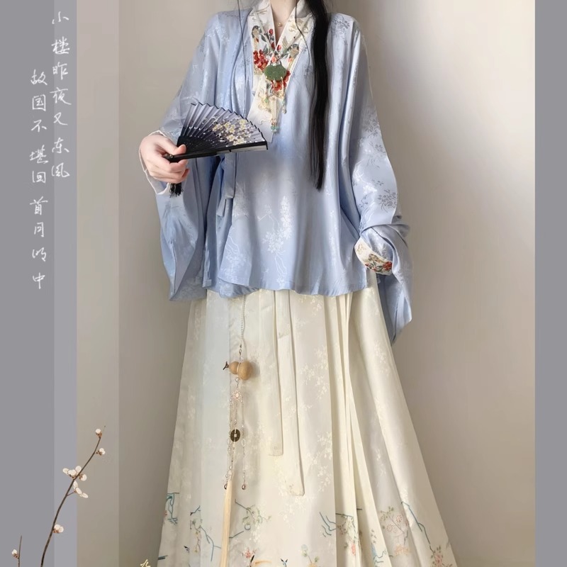 A new spring two-piece set of Chinese-style cross-collar short-sleeved shirt and horse-faced skirt created by Guochao Mingzhi for women