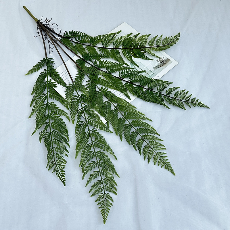 The new wedding home hotel landscape decoration features simulated green plant and fern leaf ground landscaping, complemented by plant fern leaves details Picture