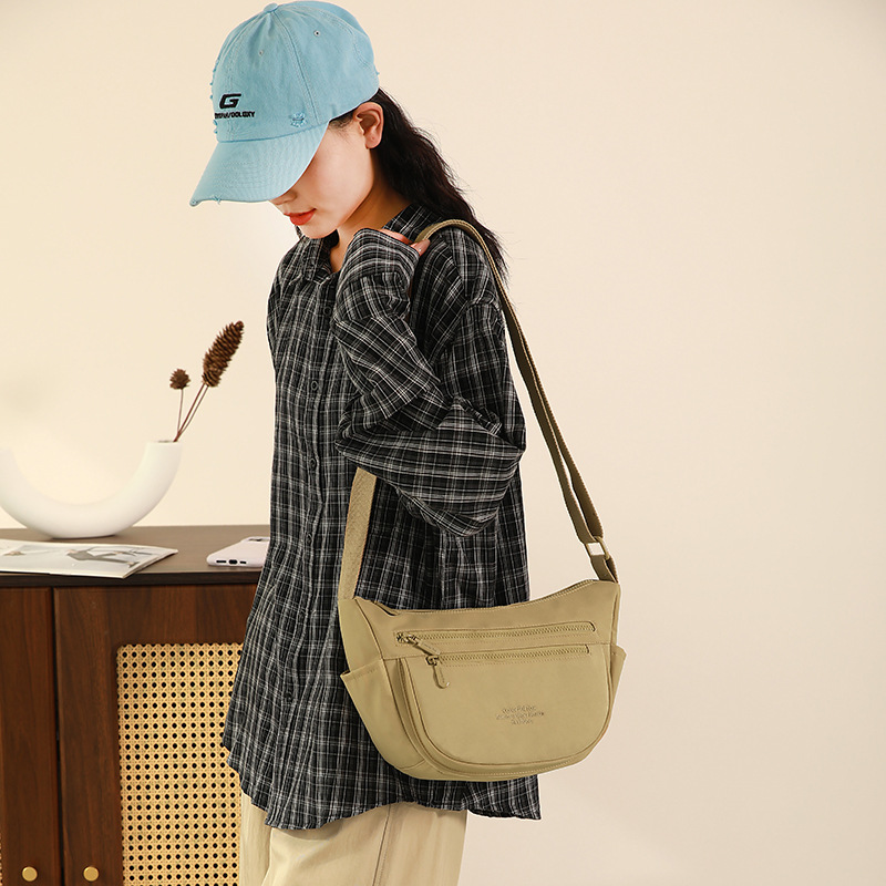 A new type of outdoor crossbody bag for men and women, featuring multi-pocket dumpling bags, water repellency and large capacity Item Picture