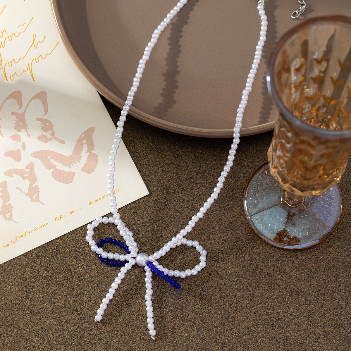 Simple and fashionable bow crystal pearl necklace, popular online, fresh and sweet design sense collarbone chain new style wholesale