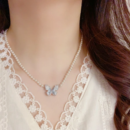 A niche, elegant, fashionable and gentle blue crystal butterfly pearl necklace for girls, fresh, sweet and versatile collarbone chain wholesale A niche, elegant, fashionable and gentle blue crystal butterfly pearl necklace for girls, fresh, sweet and versatile collarbone chain wholesale
