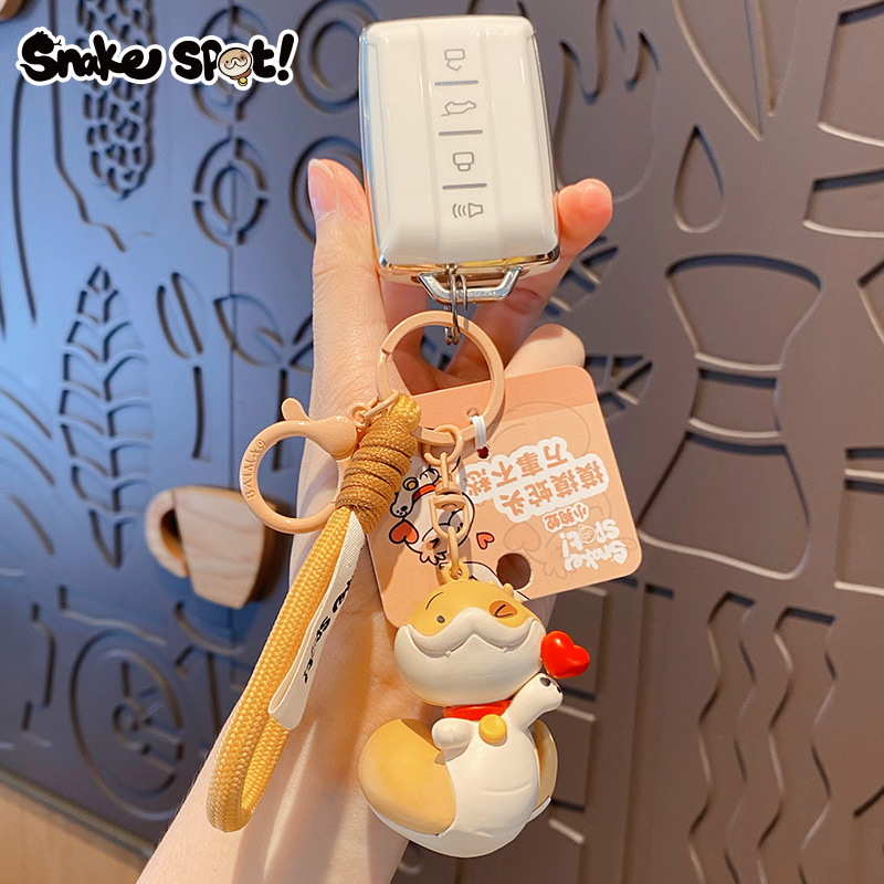 Genuine Snake Year puppy keychain, cartoon heart snake, injection-molded figure, schoolbag pendant, New Year small gift Specification image
