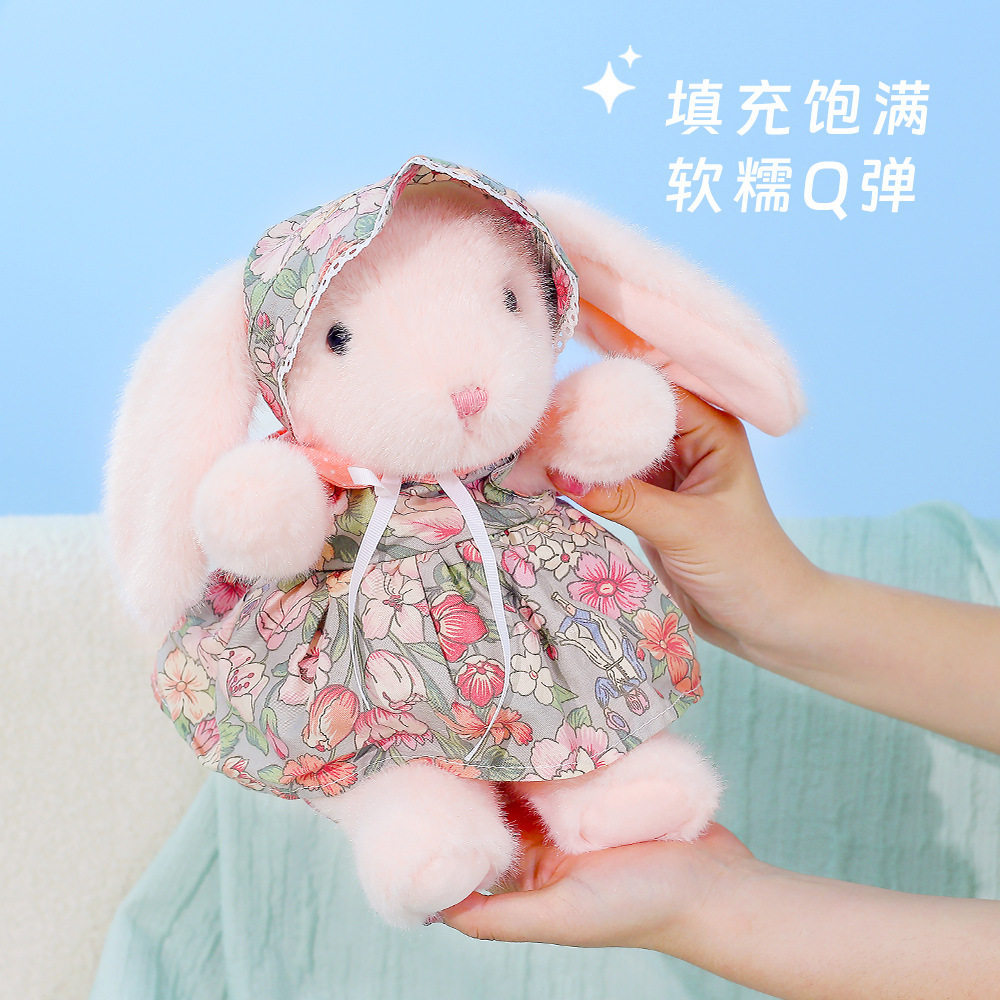 A genuine forest-themed floral dress with droopy ears, a plush rabbit doll, a floral dress, and a cute little rabbit figurine for home decoration