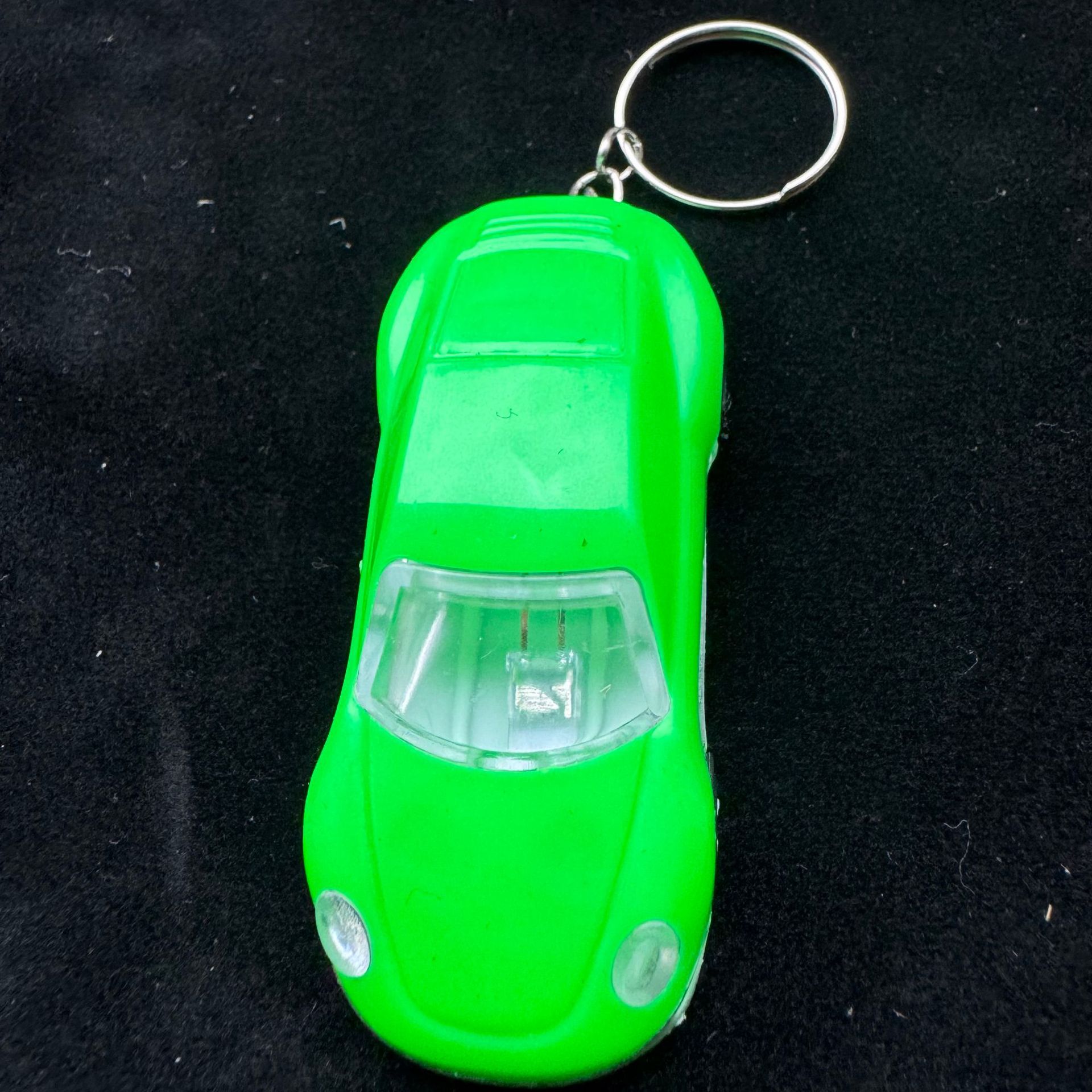 Wholesale of luminous toy car keychains, student bag pendants, fashionable car key pendants, sports car small gifts Item Picture