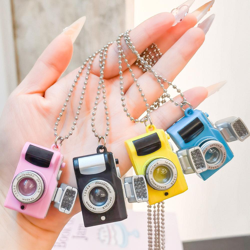 A popular light-emitting small camera with LED lights, a keychain that emits light, a camera necklace, a pendant, and a creative gift keychain full image