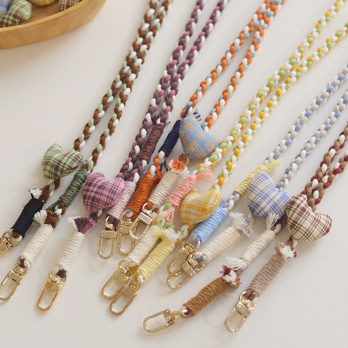 Korean-style ins checkered fabric heart-shaped hand-knitted mixed thread mobile phone lanyard, diagonal long rope shoulder strap, cross-chain twisted rope wrist details Picture