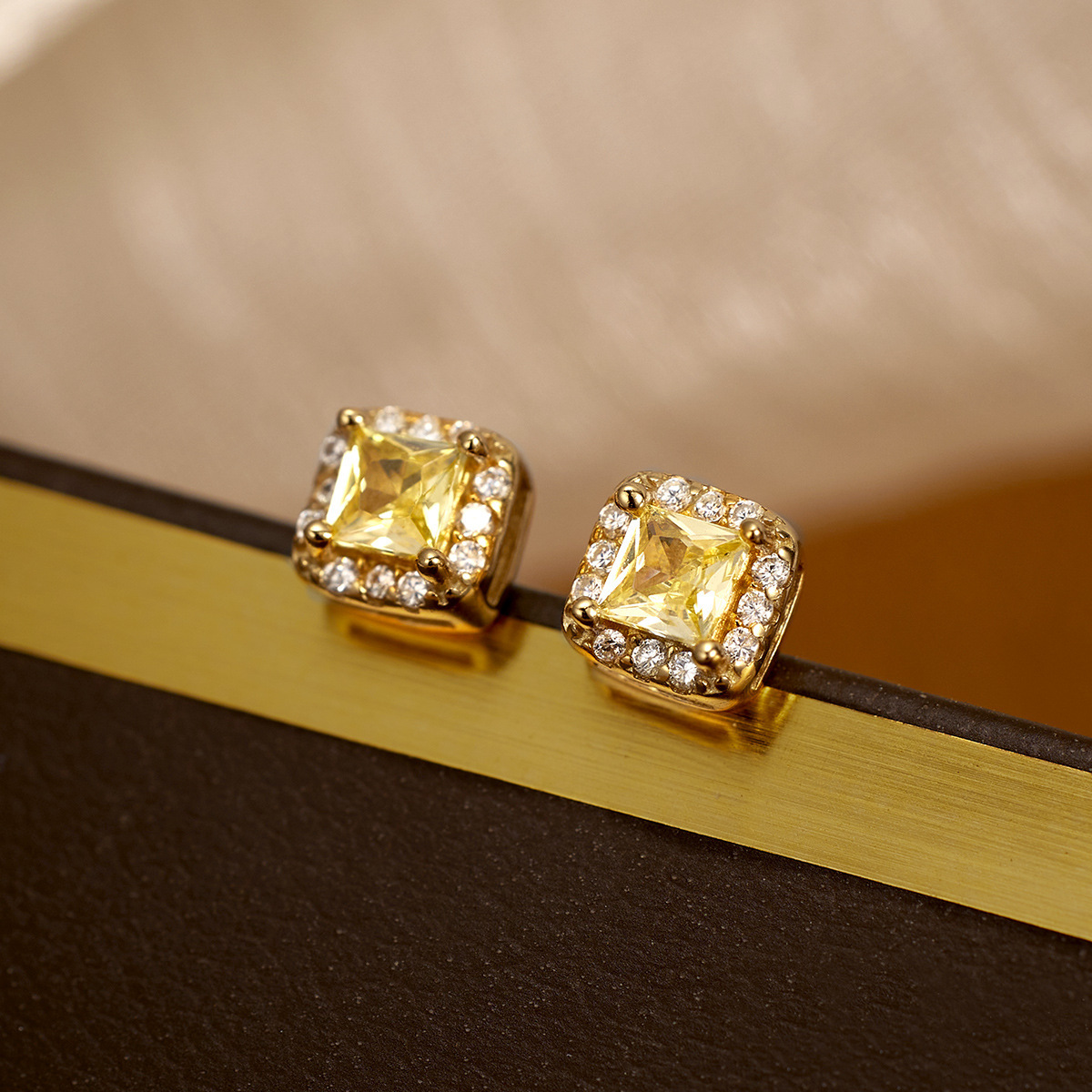 The new light luxury small square sugar stud earrings for women are fashionable and simple. The small square yellow diamond electroplated 18K silver earrings are selling well in Europe and America details Picture