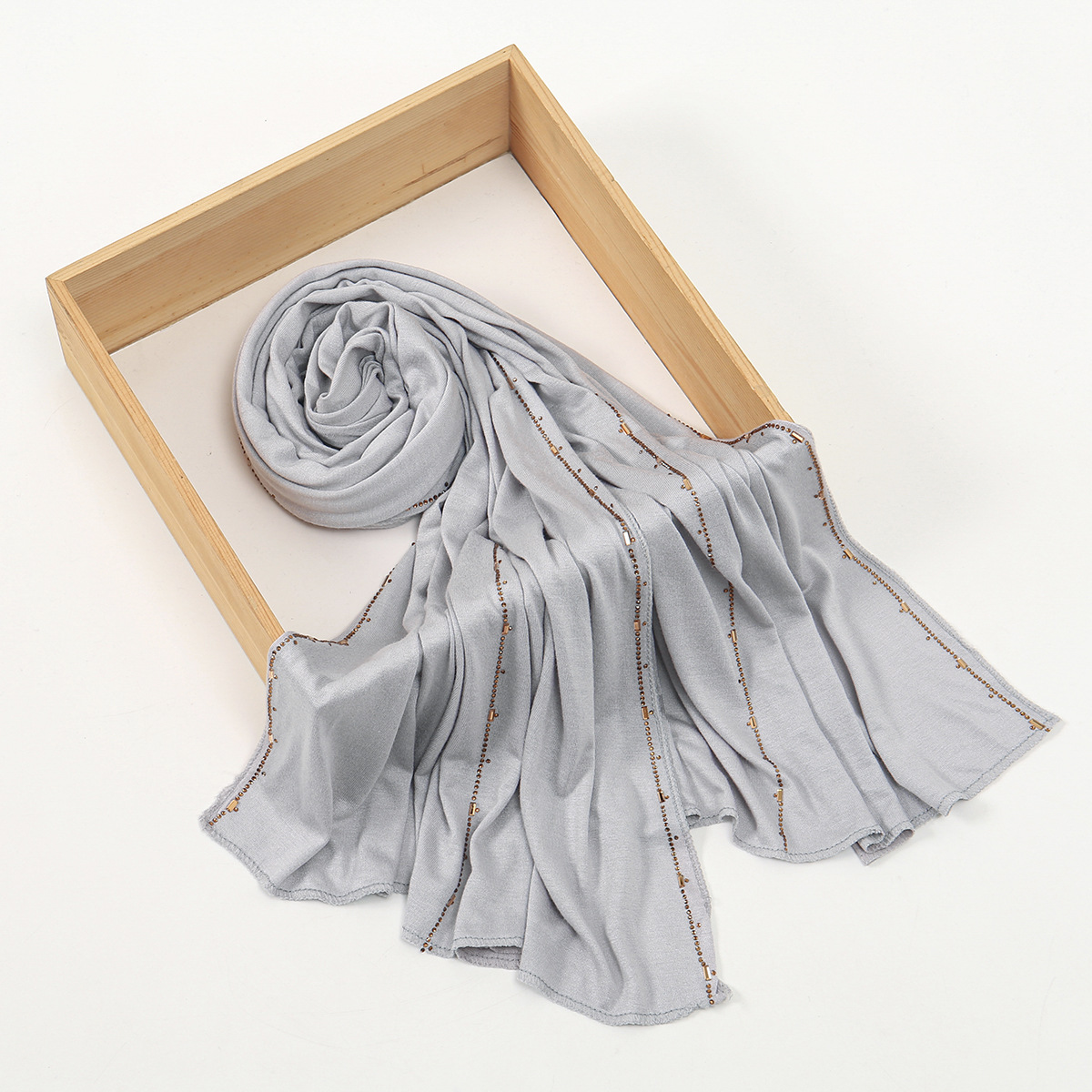 Wholesale of new Modal solid-color embossed diamond long scarves and headscarves. High-quality, breathable, soft to the touch, and lustrous cotton scarves for women Item Picture