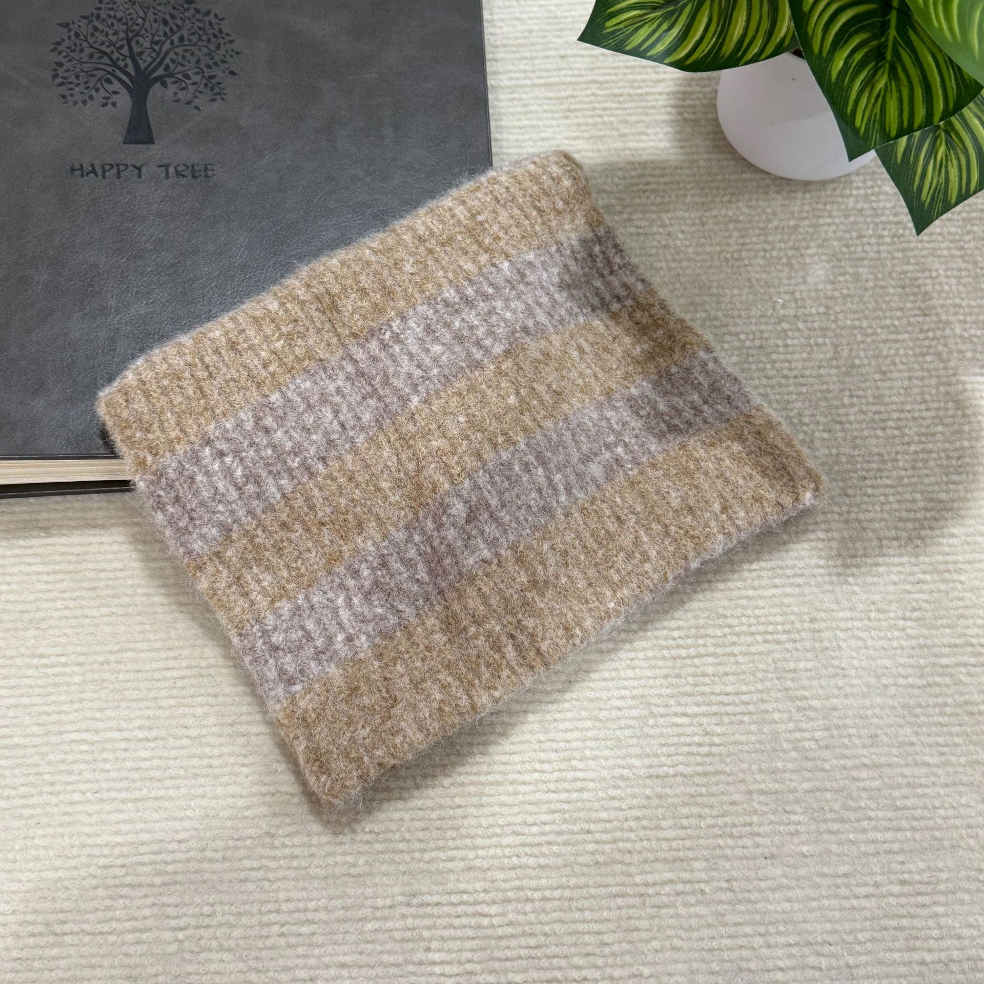 This is a versatile and face-enhancing autumn and winter knitted woolen cap with ear stripes for face protection, windproof and warmth in winter details Picture