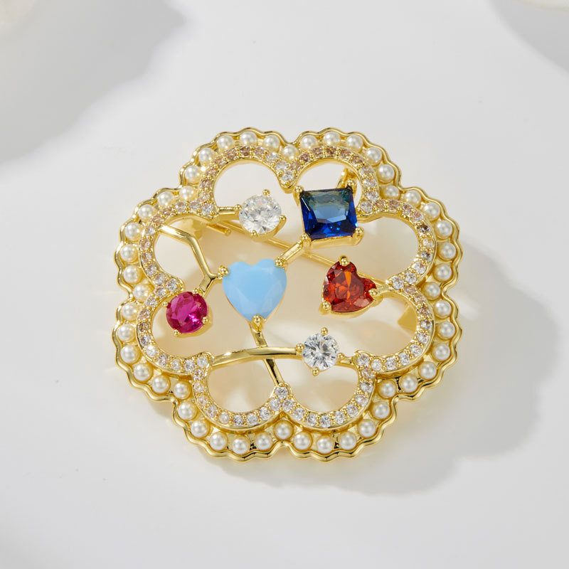 Sweet and exquisite colored gemstone hollowed-out flower brooch, copper alloy micro-inlaid zircon, light luxury and high-end dress brooch Application Scenario