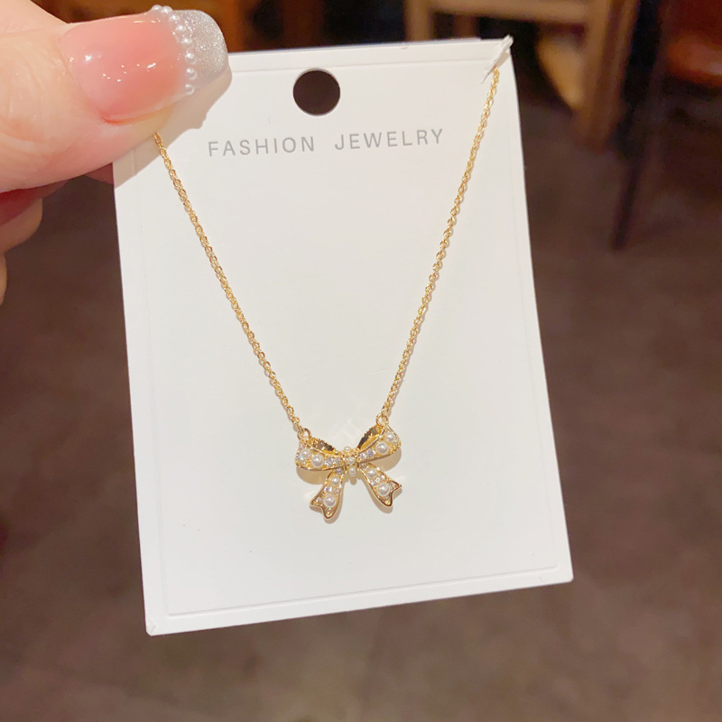 Zircon pearl bow necklace, a light luxury, niche and fashionable design for women, a collarbone chain, a versatile necklace accessory for Internet celebrities details Picture
