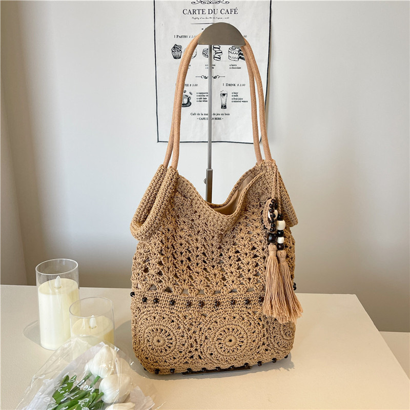 Cross-border woven bag, fringed knitted hollowed-out handbag, large-capacity fringed design single-shoulder bag, beach vacation lady's beach bag, fringed woven bag