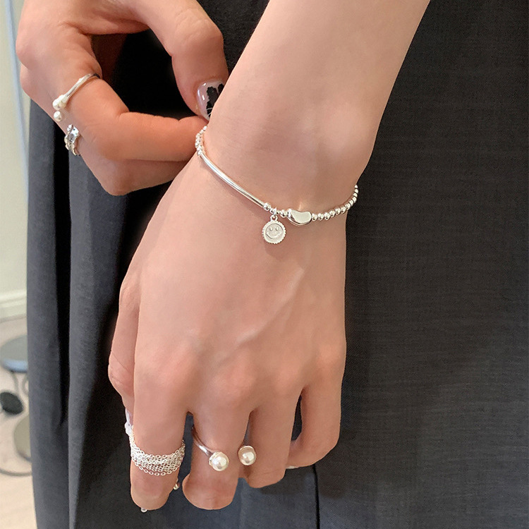 S925 sterling silver smiley face bean elastic beaded bracelet: simple and versatile, light luxury, ins niche jewelry with a sense of sophistication details Picture