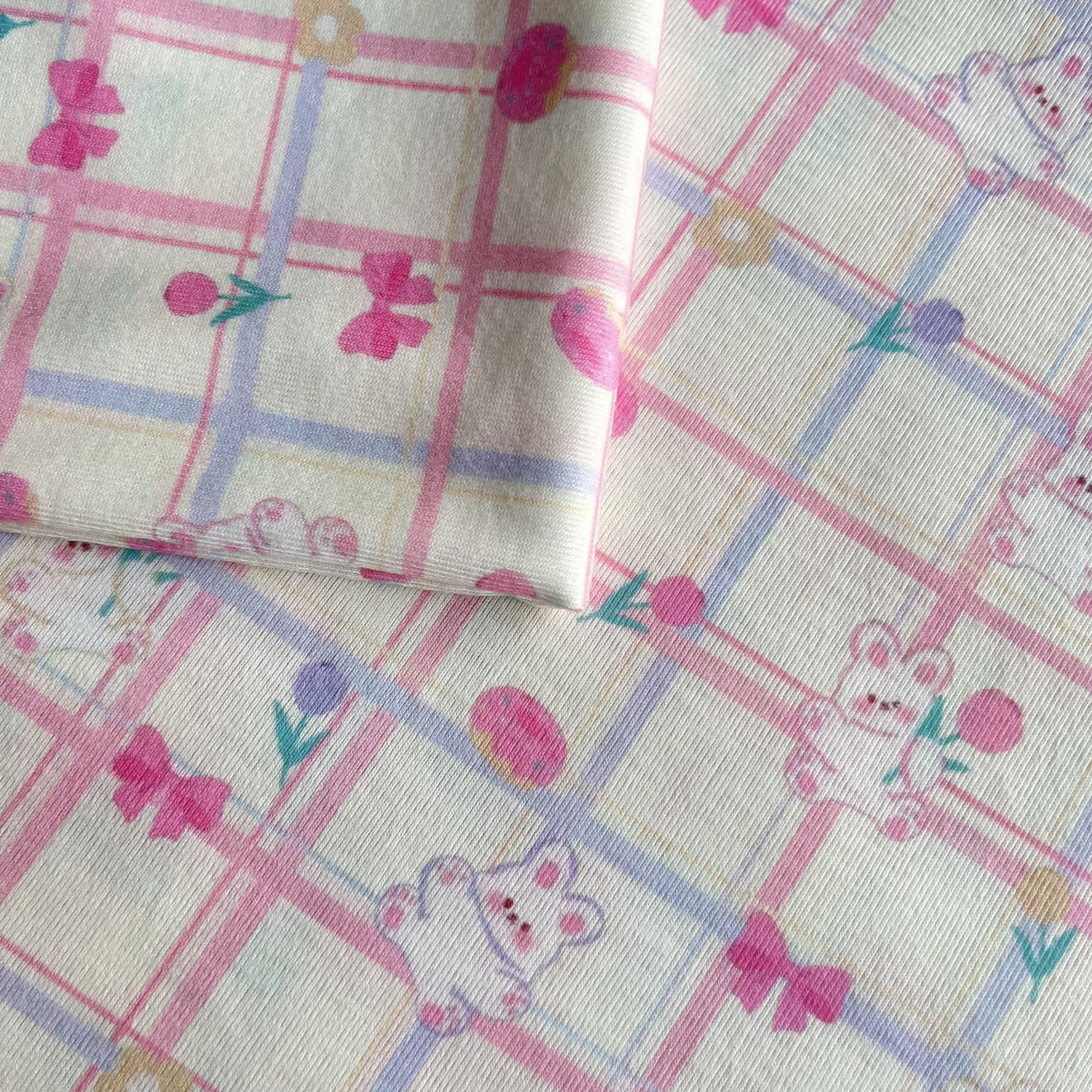 春夏时尚新品男女宝宝套装上衣可爱卡通印花弹力针织磨毛坑条面料产品图