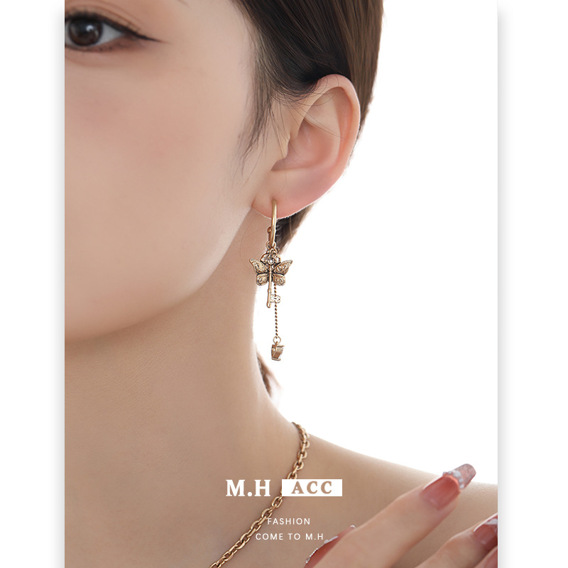 Retro and exquisite gilded key Butterfly series earrings, feminine and high-end, original design 925 silver needle earrings details Picture