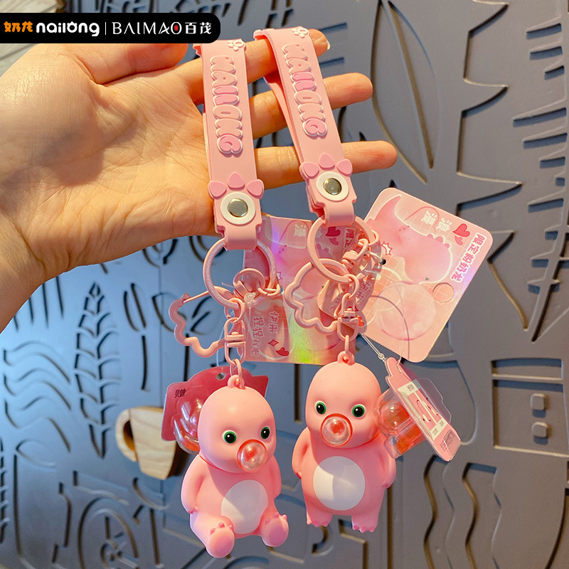 Genuine stress-relieving bubble-blowing pink milk dragon keychain, cute and creative female stress-relieving figurine key chain pendant Application Scenario