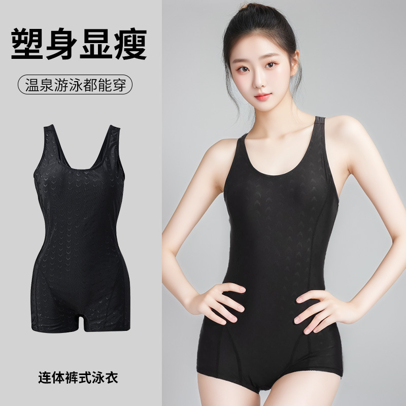 A female model in a black one-piece swimsuit showcases a sexy long-sleeved backless swimsuit made of sport fabric for women. 107044 Specification image