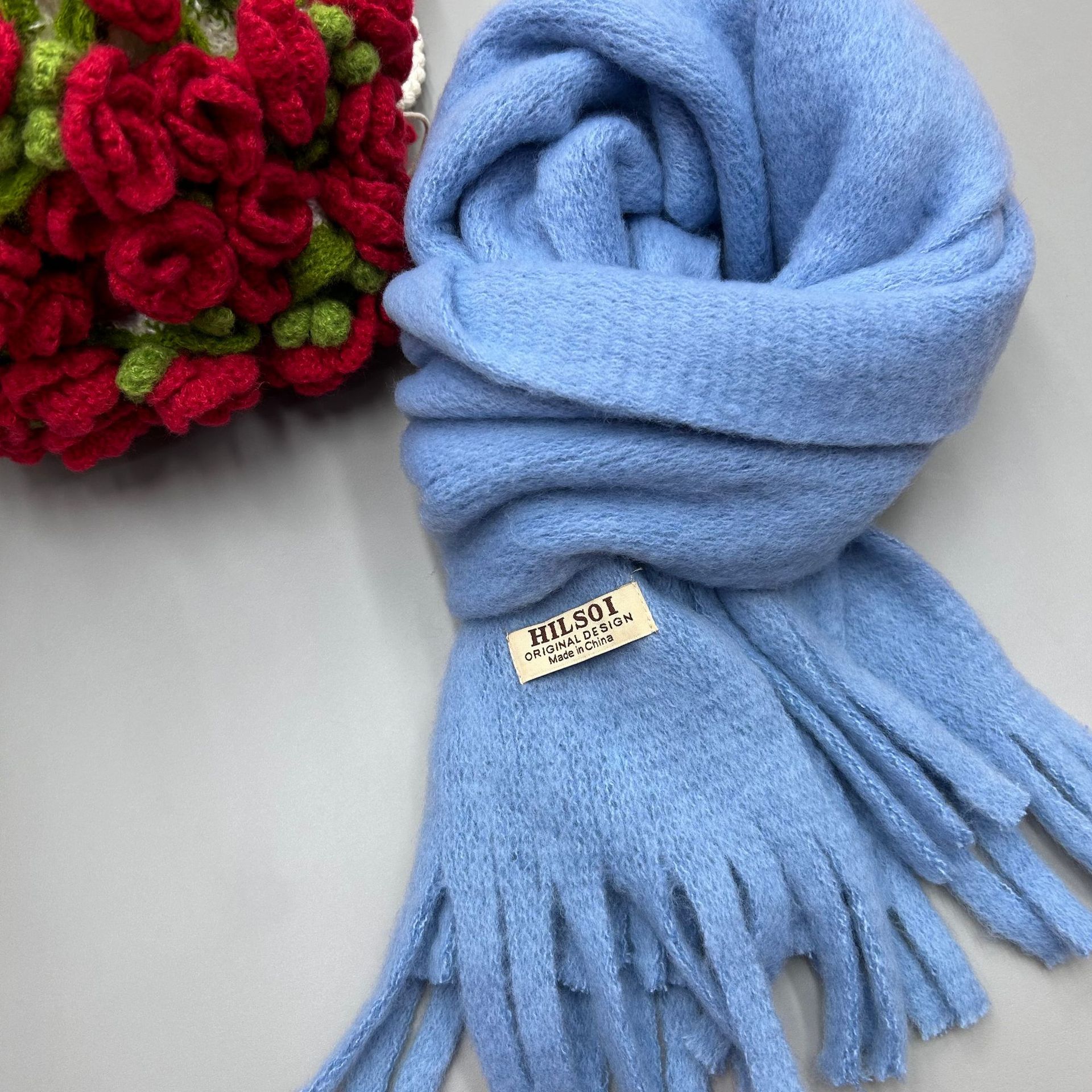 The 2024 new solid-color scarf is a must-have for women, providing warmth in winter. It's a Japanese-style, fashionable and versatile design. The thickened tassel faux cashmere scarf is also available Application Scenario