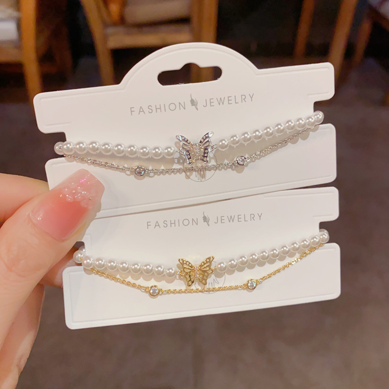 French light luxury gentle and versatile double-layer pearl chain butterfly bracelet, women's personalized light luxury design sense jewelry wholesale