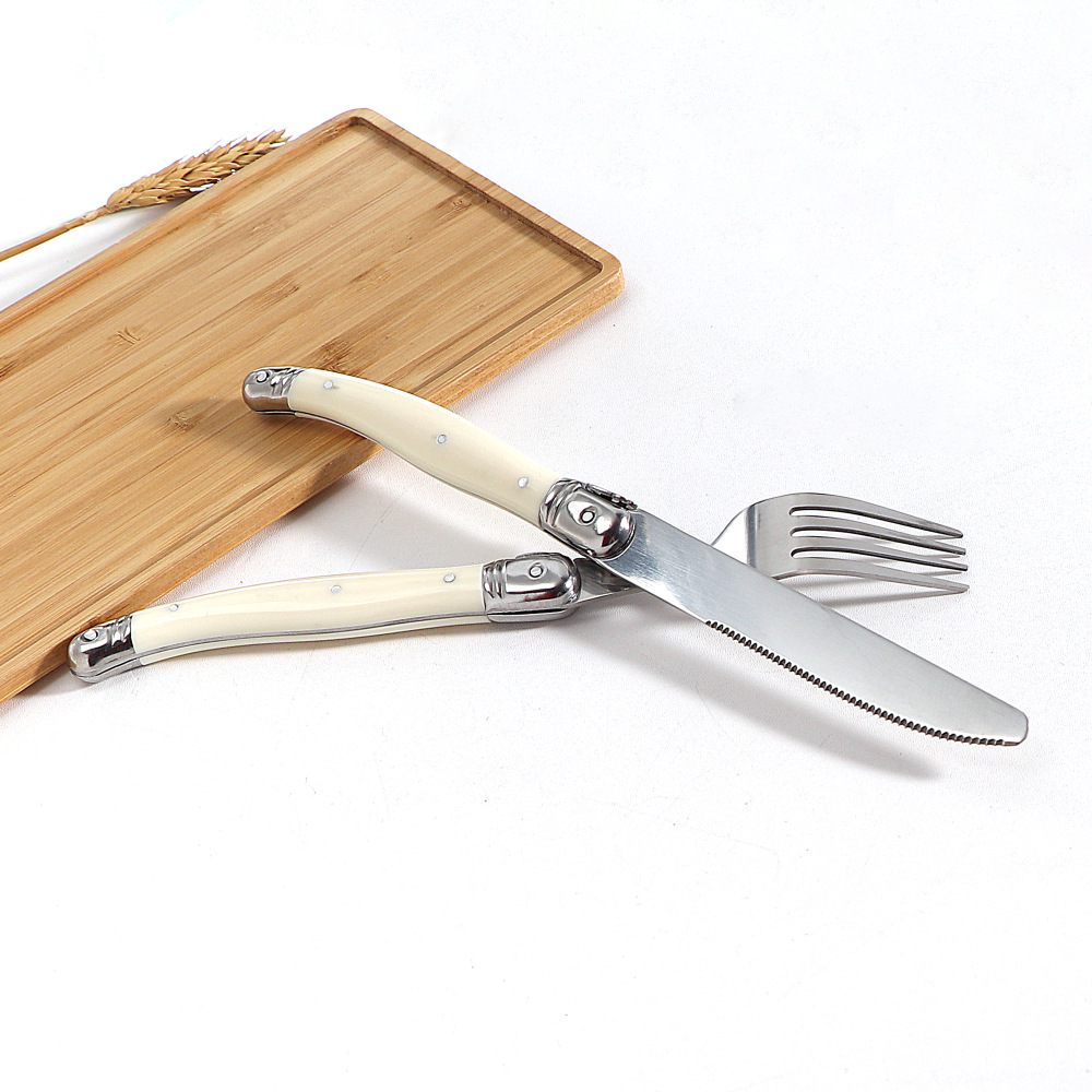 Stainless steel knife, fork and spoon set with milky white plastic handle, steak knife, steak fork and spoon, steak and Western tableware for home use Application Scenario