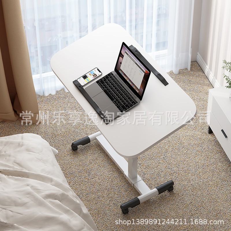 Foldable notebook computer desk, bedside table, 360-degree rotating table that can be raised and lowered, creative portable mobile small table Application Scenario