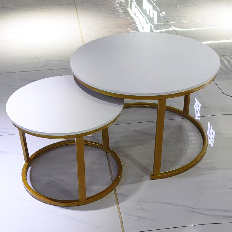 A light luxury minimalist coffee table with a round table for small-sized apartments. A creative rock plate round coffee table set for the living room details Picture
