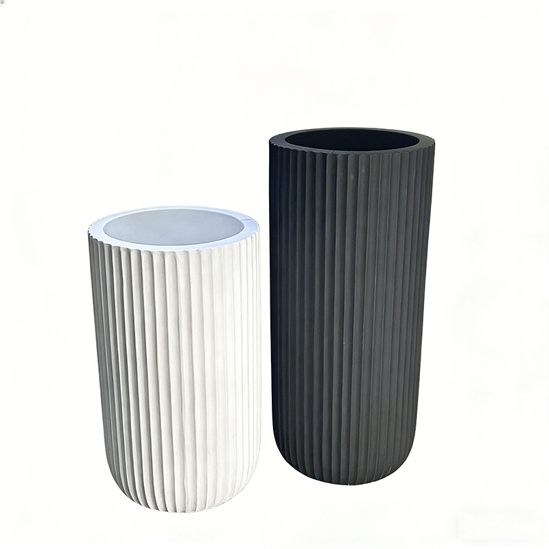 A large floor-standing plant arrangement in a minimalist style beside the sofa in the living room, featuring a new matte black and white bright color vase Item Picture