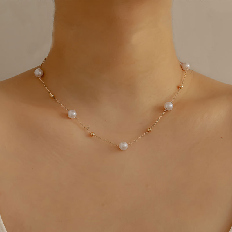 A popular cross-border pearl-like necklace for women in Europe and America, featuring a simple, fashionable and cold style. It is a metal ball necklace accessory for women in summer details Picture
