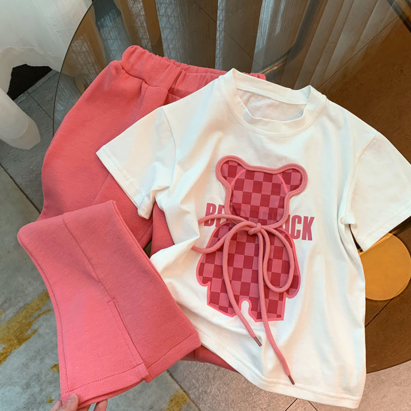 Chica traje de verano 2025 korea versión de dibujos animados estampado camiseta pantalones trompetes bebé zoar dos piezas marea