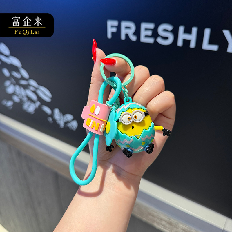 Wholesale of genuine cartoon egg Minions keychains, creative couple bags, figurines, key chains and pendants from Fuqilai details Picture