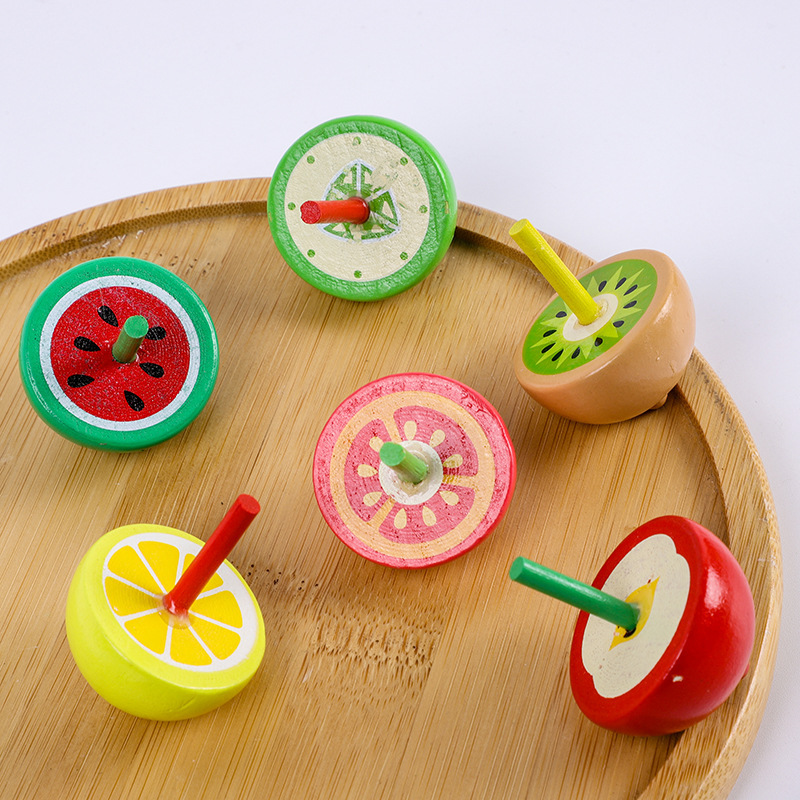 A large wooden fruit gyroscope with colorful fingers, a traditional and nostalgic wooden toy for children