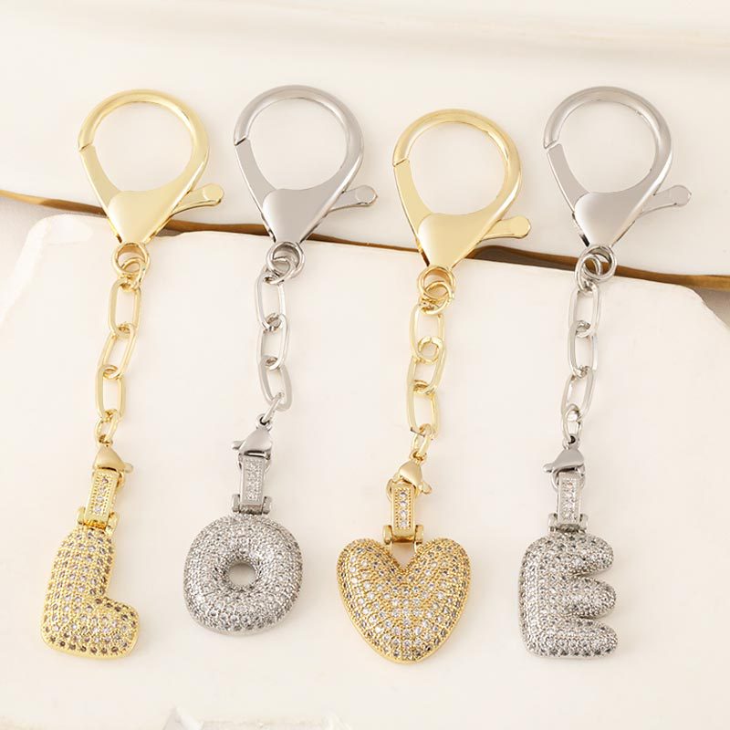 Wholesale of cross-border fashion 26-letter keychain bags, copper-plated and zirconium-inlaid letter pendants full figure