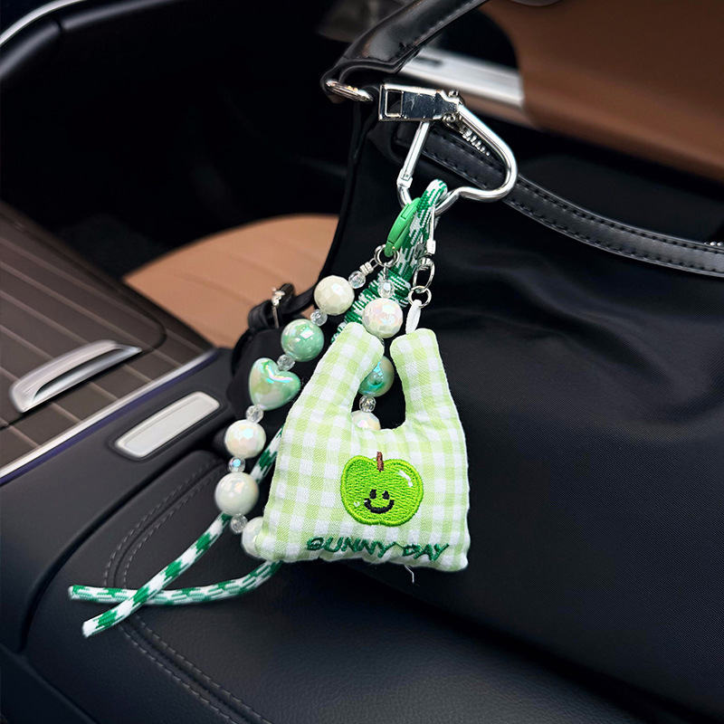 Versatile, fresh and simple fruit embroidery cloth bag, car keychain, woven rope bead string, creative and personalized bag decoration pendant Application Scenario