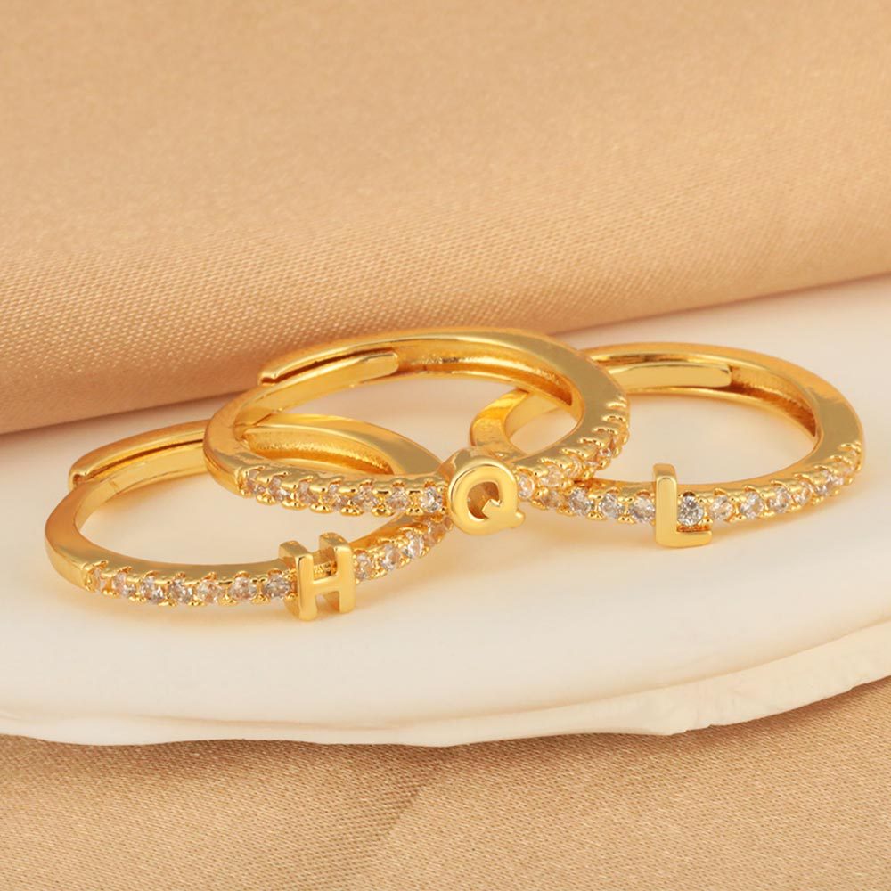 A new cross-border copper-inlaid zircon 26-letter ring with adjustable opening, exuding a fashionable and sophisticated charm full figure