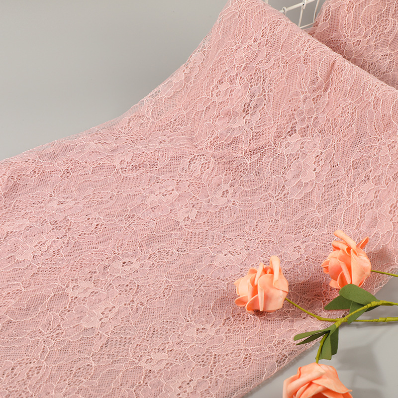 Pink brocade lace fabric with delicate small flowers and warp knitted lace fabric for dress and dress in stock Specification image