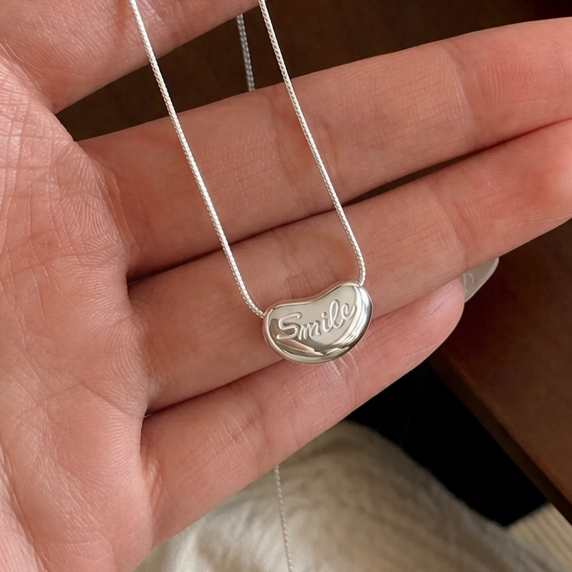 S925 sterling silver smile Pea necklace: Simple and versatile. The love bean collarbone chain features a niche design for daily wear