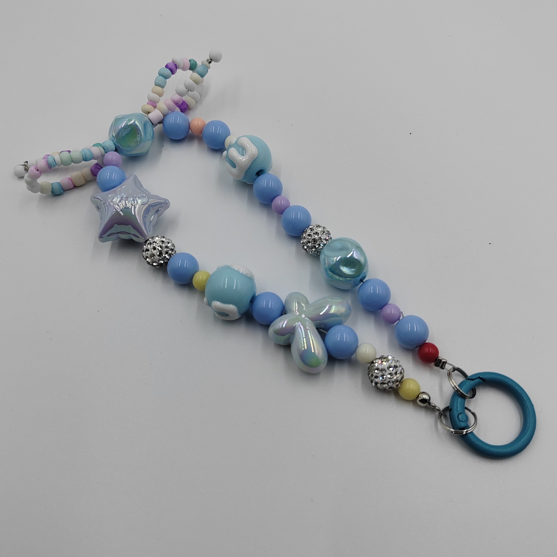 Factory direct supply of candy-colored hand-painted bracelets, new diamond balls, beaded keychains, car hangers, bows, and mobile phone pendants Specification image