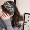 Wide-brimmed leopard print headband for women, exuding a sense of sophistication and fashion. It features a high headband style with a retro pressure on the top of the head, as well as a face-washing headband accessory Specification image