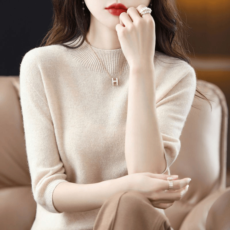 A semi-high-neck casual knitted sweater for women in spring 2023, in a solid color, paired with a half-sleeved base layer sweater T-shirt details Picture