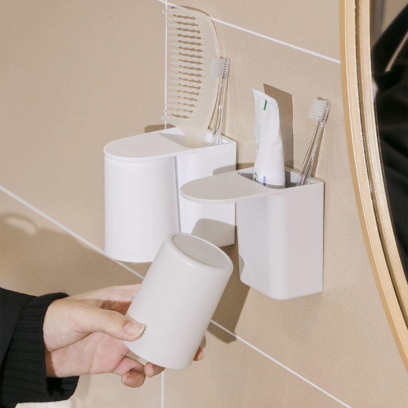 A magnetic toothbrush cup for a family of three is hung upside down at the bottom to drain water. A magnetic mouthwash cup is hung on the wall to brush teeth Specification image