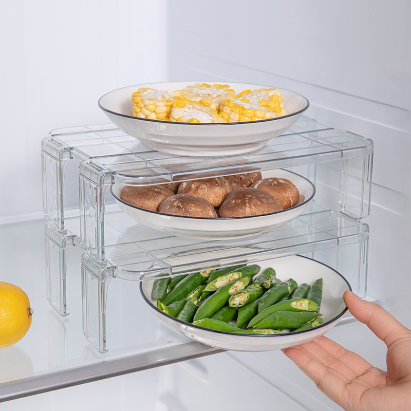 The interior of the refrigerator storage rack is equipped with multiple layers of kitchenware for household use. It features a tiered and partitioned noodle bowl rack and a seasoning bottle storage rack details Picture