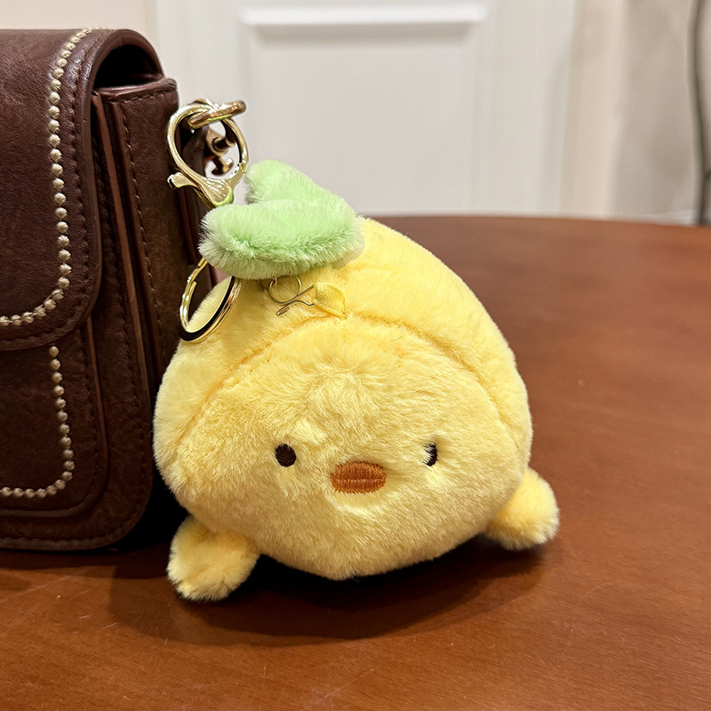 The little cat doll that wags its tail by pulling a rope is called the popular little white rabbit plush toy backpack doll at the street stall