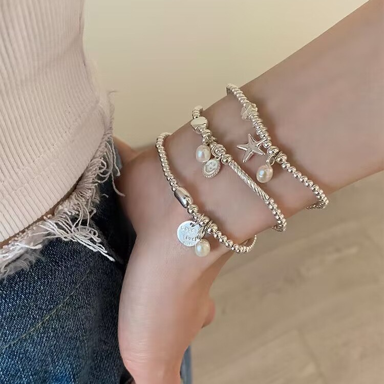 S925 sterling silver simple and elegant starfish smiling face pendant beaded bracelet, light luxury, niche and exquisite, a perfect accessory for your best friend Item Picture