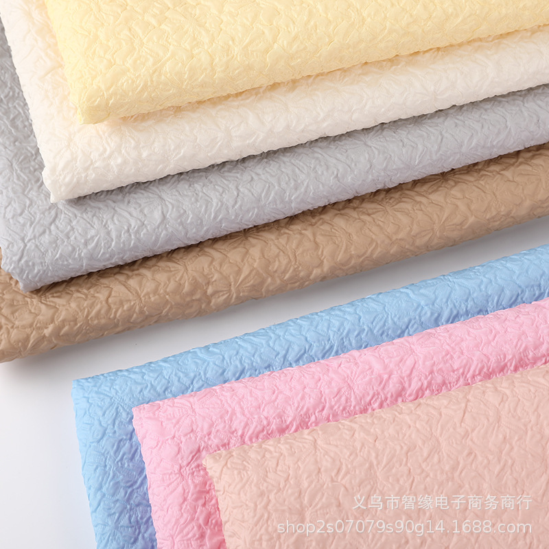 The manufacturer has in stock three-dimensional chrysanthemum embossed bubble fabric, flower packaging materials, luggage accessories, double-layer bubble fabric and composite fabric Specification image